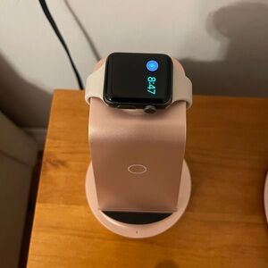 Apple Watch with Cream Band on Rose Gold Stand